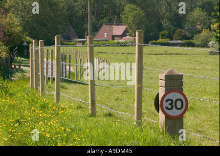 An illegally erected fence around Hanworth Common North norfolk Stock Photo