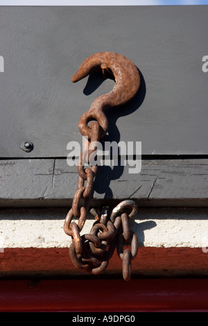 Hook and chain hanging above a garage door Stock Photo