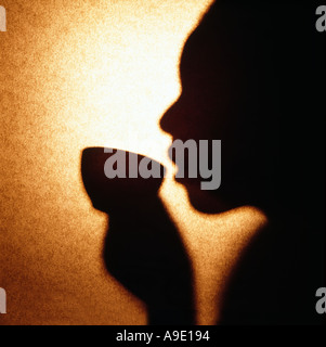 Woman African American drinking coffee tea holding cup Stock Photo