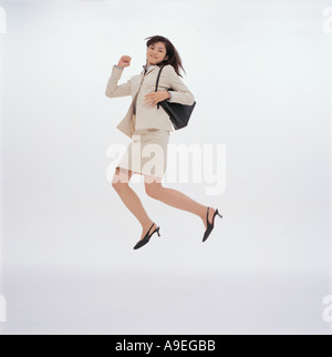 Jumping business woman Stock Photo - Alamy