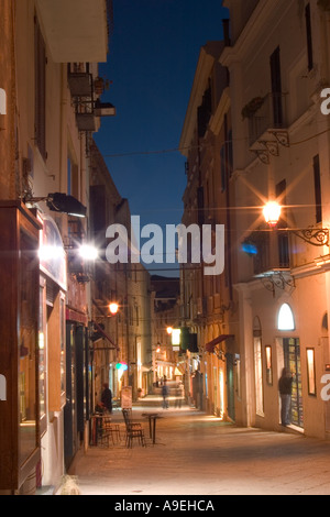Shopping street at night. Alghero old town, Sardinia Stock Photo