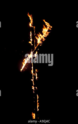 Burning Cross in the Night Ku Klux Klan hate groups Stock Photo