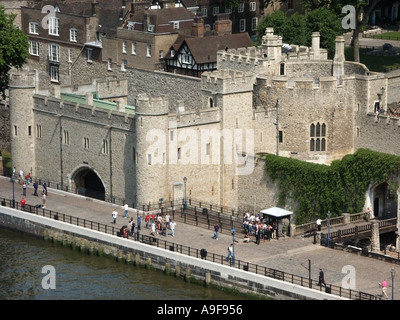 Aerial view looking down on riverside close up part of historic Tower of London with water-gate 'Traitors' Gate' linked to River Thames England UK Stock Photo