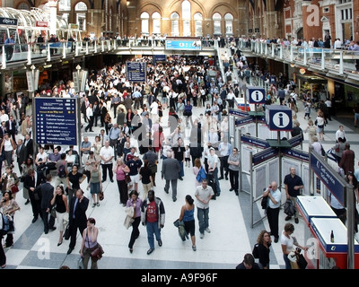 London travel problems in City of London crowd of people at Liverpool street train station wait on main concourse for transport restart news England U Stock Photo