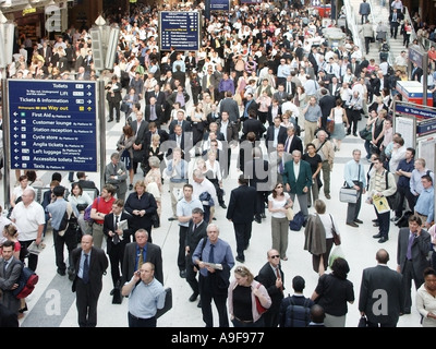 Liverpool street train station travel disruption interior concourse aerial view crowd of delayed commuters evening rush hour City of London England UK Stock Photo