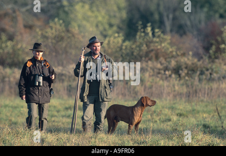 two hunters with hunting dog. Stock Photo