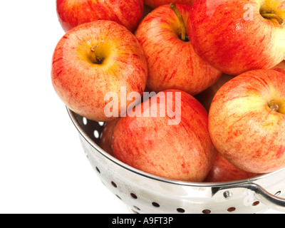 Selection Of Fresh Ripe Healthy Organic Red Apples In A Kitchen Colander Isolated Against A White Background With No People And A Clipping Path Stock Photo