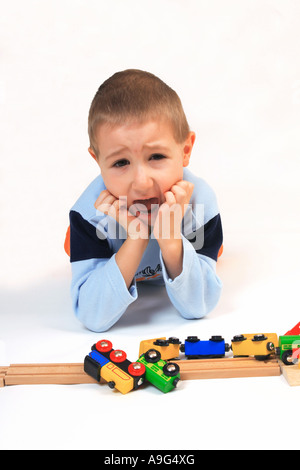 boy playing with toy railway Stock Photo