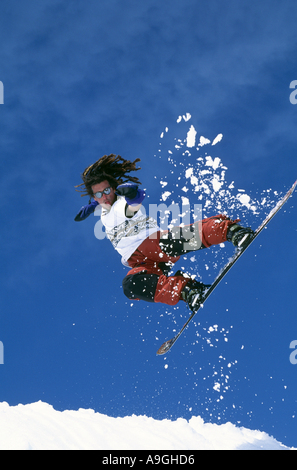 snowboarder jumping in midair. Stock Photo