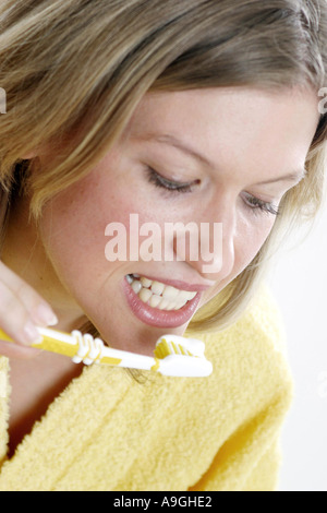 woman brushing her teeth. Stock Photo