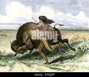 Native American hunting buffalo on foot Great Plains. Hand-colored woodcut Stock Photo