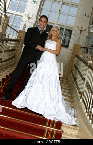 bridal couple standing on stairs. Stock Photo