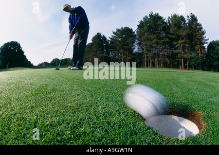 golfer putting Surrey England UK model released Stock Photo