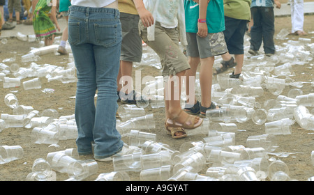 Children breaking used drink containers at the Cambridge Folk Festival, England Stock Photo