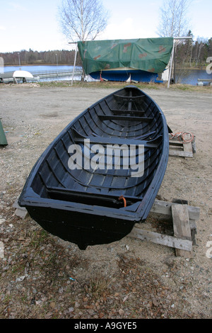 tar covered boat Stock Photo