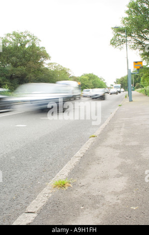 YELLOW GATSO ROAD SPEED CAMERA ON BUSY ROAD WITH SPEEDING CAR 5 OF 5 Stock Photo