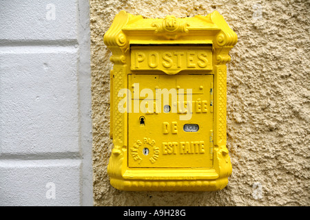 Old style post box on wall in small French town 2007 Stock Photo