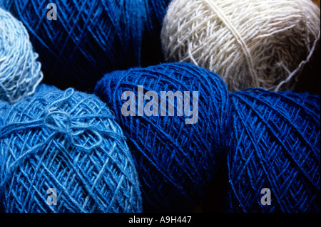 Balls of hand dyed  blue and grey wool. Stock Photo