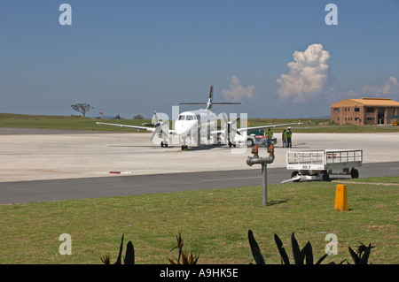 Jetstream aircraft on tarmac at Kruger International Airport being loaded with luggage Stock Photo