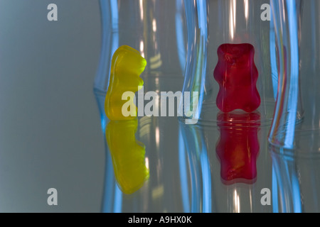 Gummi bears in front and behind glass Stock Photo