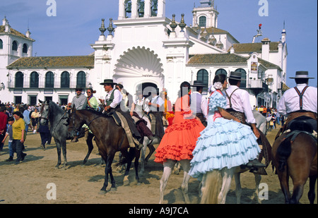 andalucia el rocio romeria pilgrims on horses with traditional flamenco costumes Stock Photo