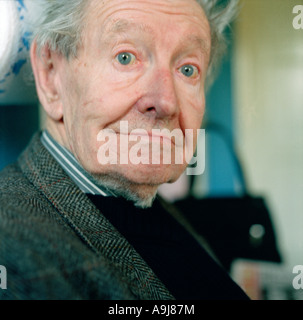 Granddad in his kitchen, without his glasses you can see his big blue eyes as he looks into the camera. Taken 2003, Richmond, UK Stock Photo