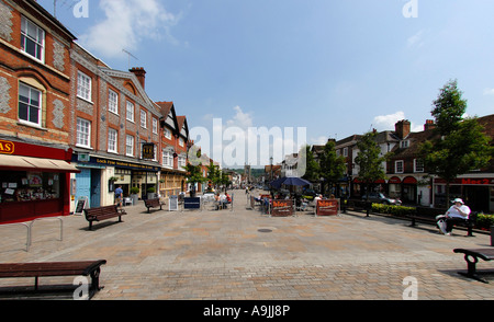 Cafes and the main street of Henley on Thames with the Holy Trinity Church of England Church in the background Stock Photo