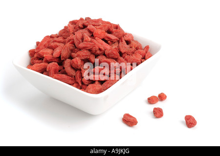 Dried Goji berries in dish Stock Photo