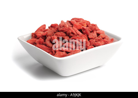 Dried Goji berries in dish Stock Photo