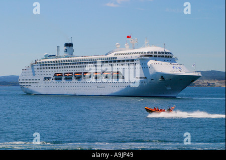 Regal Princess cruise ship and whale watching tour boat approaching entrance to harbour of Victoria Stock Photo