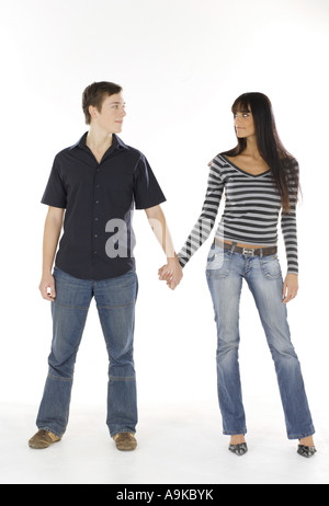 young couple going hand in hand Stock Photo