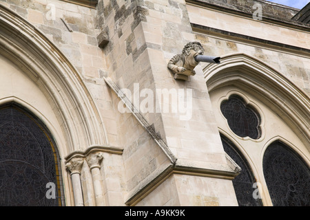 Modern restored replacement gargoyle modelled on a lawyer barrister or judge Chichester Cathedral Sussex Stock Photo