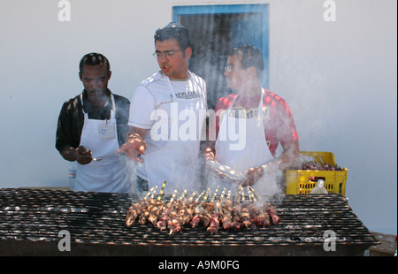Cooking food on a BBQ for the  Lag B'Omer  festival at La Griba synagogue Djerba Stock Photo