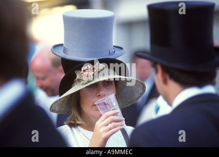 Top Hats. 1980s UK. Young woman wearing several, a grey and black top hat at the races having fun  Royal Ascot Ladies Day Berkshire England. Stock Photo