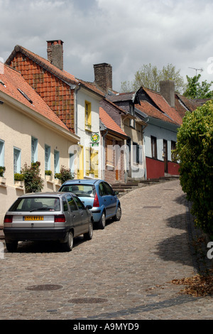 Small cottages and gites in narrow street near church Auxi le Chateau Stock Photo