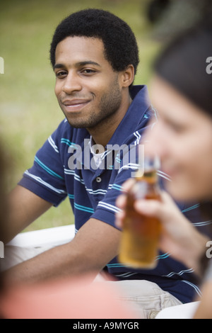Side view of a smiling young man Stock Photo