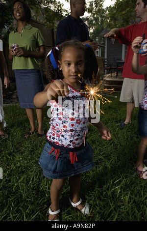 Little girl on 4th of July playing with sparkler Stock Photo