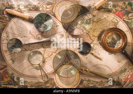 Still life of old map with magnifying glasses Stock Photo