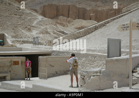 Entrance to the tomb of Tut Ankh Amon, Valley of the Kings, Luxor, Egypt. With tourist taking photo. Stock Photo