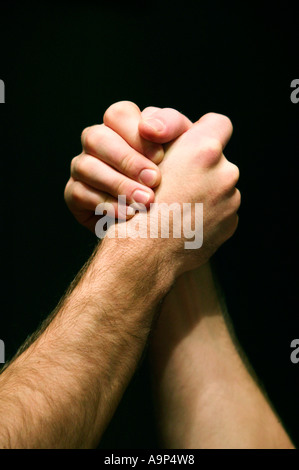 Closeup of men arm wrestling Stock Photo