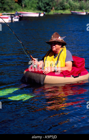 Fly Fisherman in a Belly Boat fishing for Trout in Hi Hium Lake in the  Cariboo Region of British Columbia Canada Stock Photo - Alamy