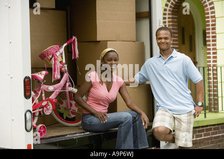 Young couple near a moving truck Stock Photo