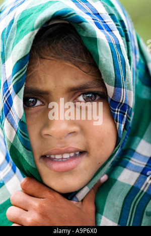 Young Indian girl with her head covered in a cloth Stock Photo