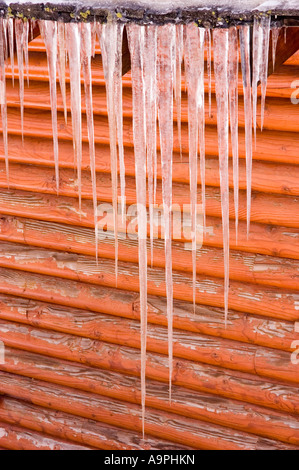 Icicles hanging from the eve of a cabin June Lake California Stock Photo