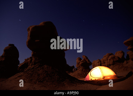 A glowing tent at Goblin Valley State Park UT Stock Photo