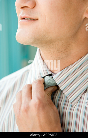 Man adjusting tie Stock Photo