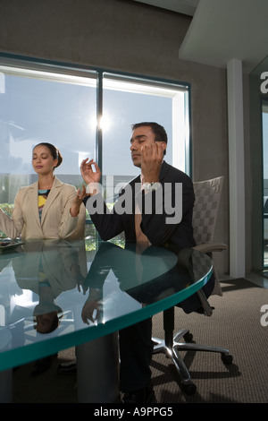 Business people meditating Stock Photo