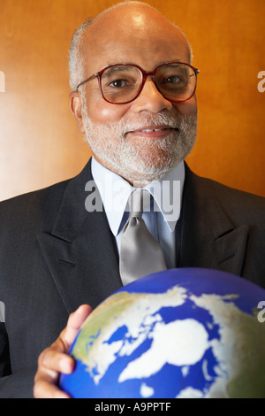 Ceo holding a globe