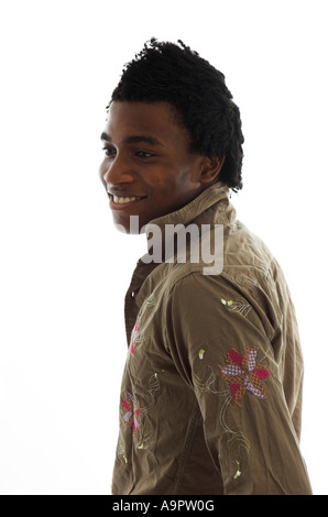Studio shot of attractive fashionable young black man looking back over his shoulder with a happy expression Stock Photo