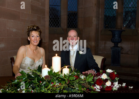 Bride and groom signing the register Stock Photo